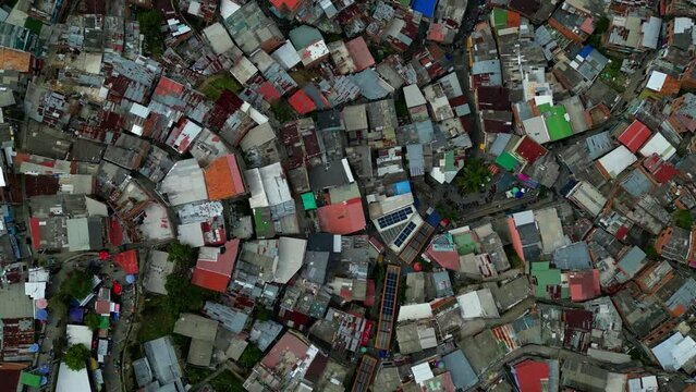 escaleras electricas in Comuna 13 Medellin Colombia graffiti and pablo escobar tour,  tourist attraction. people walking. drone shot