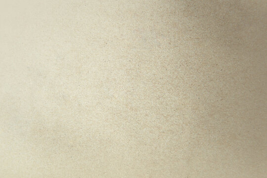 Light beige brown sandy or grey paint on cardboard box blank kraft paper texture environmental friendly background with space design minimal style