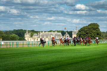 Horse race near the castle of Chantilly, France. - obrazy, fototapety, plakaty