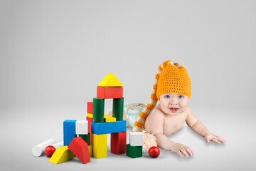 little baby girl playing with colorful toys cubes