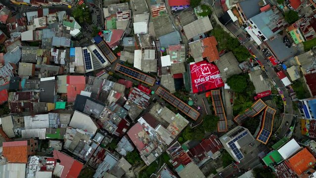 escaleras electricas in Comuna 13 Medellin Colombia graffiti and pablo escobar tour,  tourist attraction. drone shot