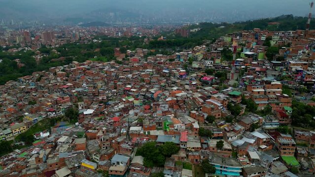 Comuna 13 Medellin Colombia escaleras electricas, graffiti and pablo escobar tour,  tourist attraction. drone shot, view from above 4k