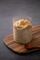 Vertical shot of a freshly made cup of delicious caramel macchiato chia pudding