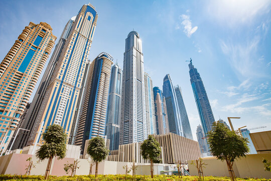 Dubai, UAE &ndash; april 11, 2023: Dubai International Marine Club, view of skyscrapers and Princess Tower, Ciel, Elite Residences Tower at clear day, bottom view