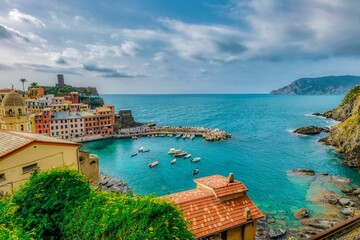 Vibrant view of the Vernazza, Cinque Terre Bay and the picturesque skyline in the background