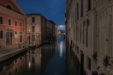 Picturesque scenery around the tranquil canals at night in Venice, Italy