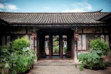 Facade of an old traditional Chinese house in the Zhu family garden in Jianshui, China.