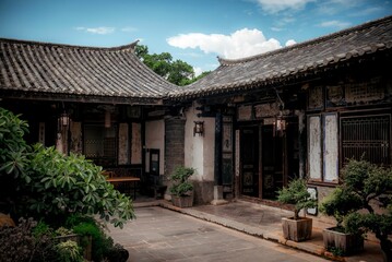 Fototapeta na wymiar Facade of an old traditional Chinese house in the Zhu family garden in Jianshui, China.