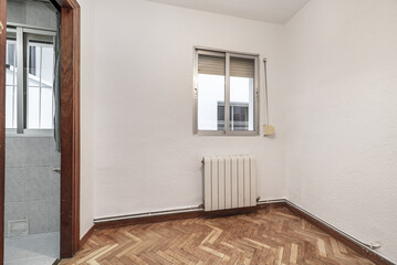 Empty room of an old house with oak wooden floors
