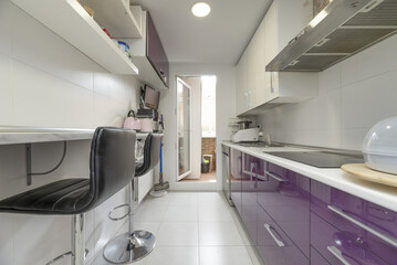 A narrow kitchen room fitted on both sides