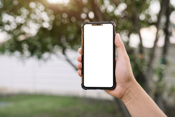 Man holding smartphone, close-up of hands. Space for text.