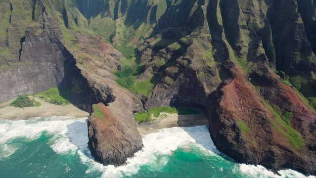 Aerial view of Napali Coast Kauai island Hawaii USA with jungle mountain peaks  on Na Pali park.  Breathtaking hike View of mountain ridge of Kokee State park. Summer adventure travel.