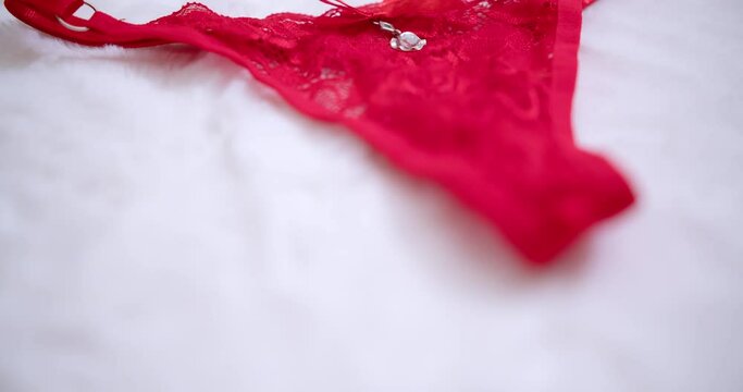 Red woman g-string underwear fashion for the seductive romance of sex.