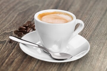 Tasty hot aroma coffee on the desk