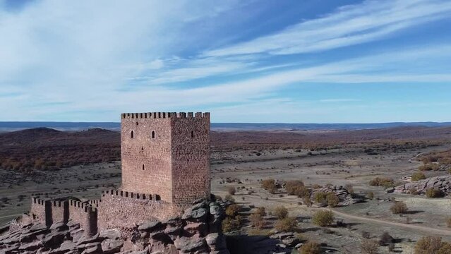 Drone view over Zafra Castle in Campillo de Duenas
in Spain with sea in the background