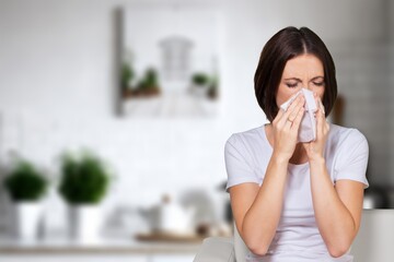 Sad young woman hold tissue sneeze