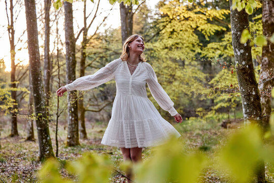 cheerful girl in white dress