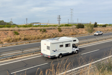 Campervan drive on highway. Family rv camper van vehicle driving on european highway road at...