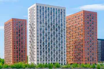 Beautiful exterior of modern skyscrapers against a blue cloudy sky during daytime