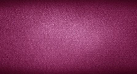 Poker table felt background in red color with dark vignette.