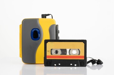 a yellow and black cassette player on a white background