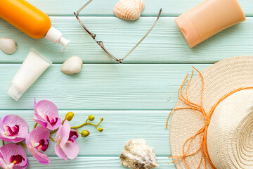 Summer travel set with sunprotection cosmetic and straw hat