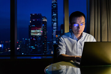 Man working with laptop at night