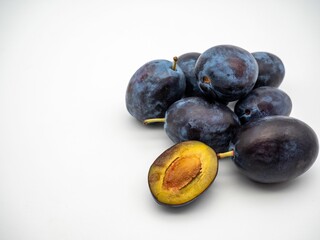 Fresh plums on the white background