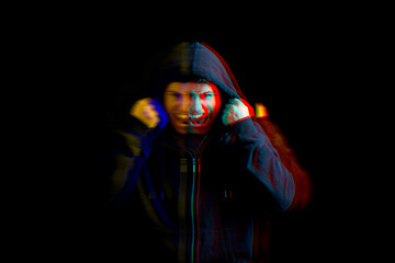 Paranoia. Man screaming on black background, glitch effect