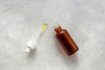 Face serum essential oil in dropper bottle top view