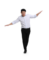 Businessman in formal clothes posing on white background