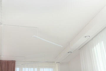 Obraz na płótnie Canvas White ceiling with modern lighting in office