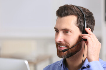 Hotline operator with headset working in office, space for text