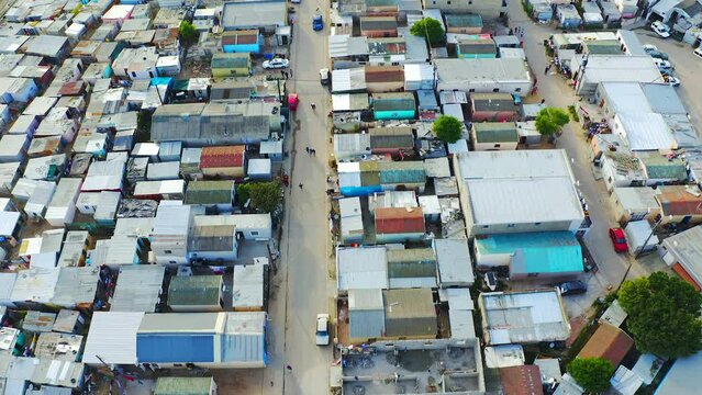 Township houses, poverty and informal settlement or community with drone in South Africa. Aerial view of inequality, population and urban slum or squatter camp environment for poor people or society