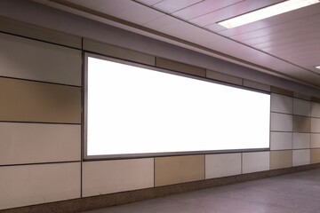 Long empty hallway with white screens on the wall