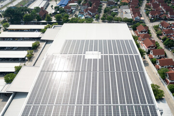 Eco building, shopping center in aerial view. Solar cell or photovoltaic cell in panel on top of roof to generate electrical power or direct current electricity. Green, clean energy for future.