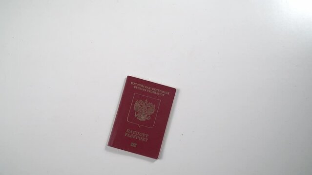 A Ukrainian citizen presents their passport