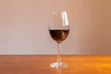 Closeup of a red wine glass on a table