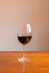 Closeup of a red wine glass on a table