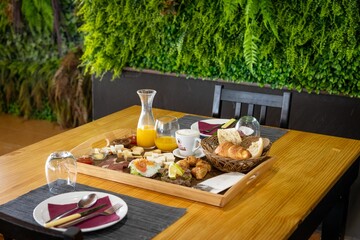 Scenic view of a food tray filled with different variations of food placed on a wooden table