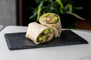 Closeup of lavash roll with meat and vegetables