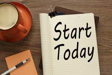 start today open notepad with clip. text on the page. Business, motivational and create future concept.