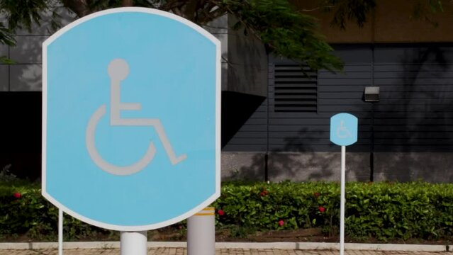 Close-up view of a handicap parking sign outdoors