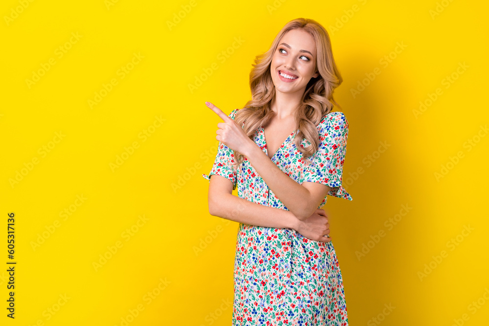 Sticker Photo of positive stunning pretty lady wear stylish clothes demonstrate empty space nice offer isolated on yellow color background