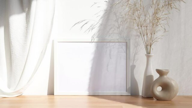 Video white 4x3 photo frame mockup with white and beige vases on wooden table