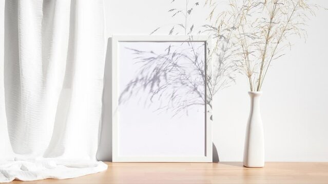 Video white 3x4 photo frame mockup with white vase on wooden table