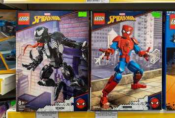 Fototapeta premium Lego Spiderman constructor game on shelf in a Toys store. Spider-Man is a fictional superhero in American comic books published by Marvel Comics. Minsk, Belarus, 2023