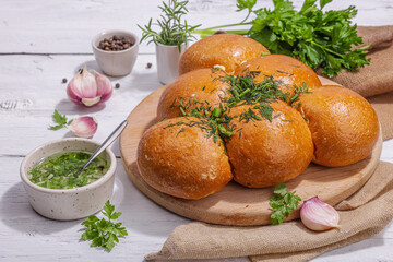 Aromatic garlic buns. Fresh baked goods, a traditional gluten-free soup snack. Parsley, spices