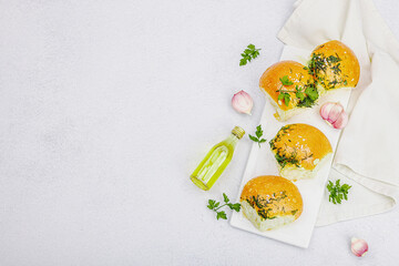 Aromatic garlic buns. Fresh baked goods, a traditional gluten-free soup snack. Parsley, spices