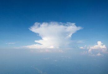 Naklejka na ściany i meble Aerial view of sky above the clouds